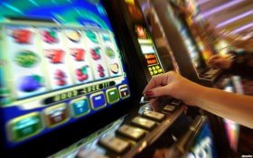 Filipino sports fan checking jili100 bet markets on a smartphone